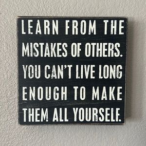 Black wooden sign - mistakes